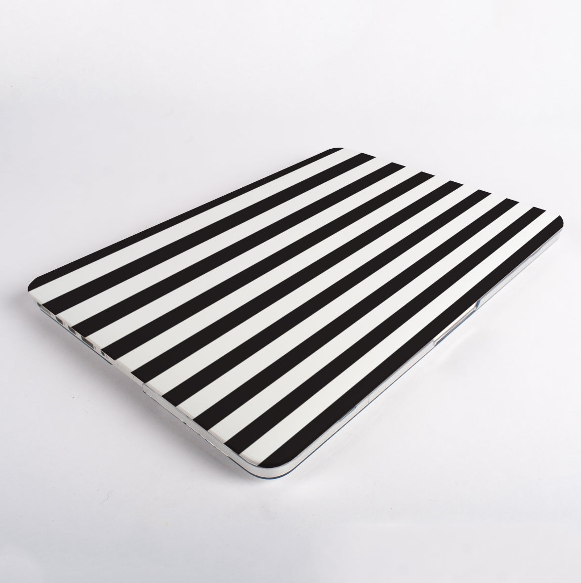 Top view of Black and white striped pattern MacBook case on a MacBook with white background.