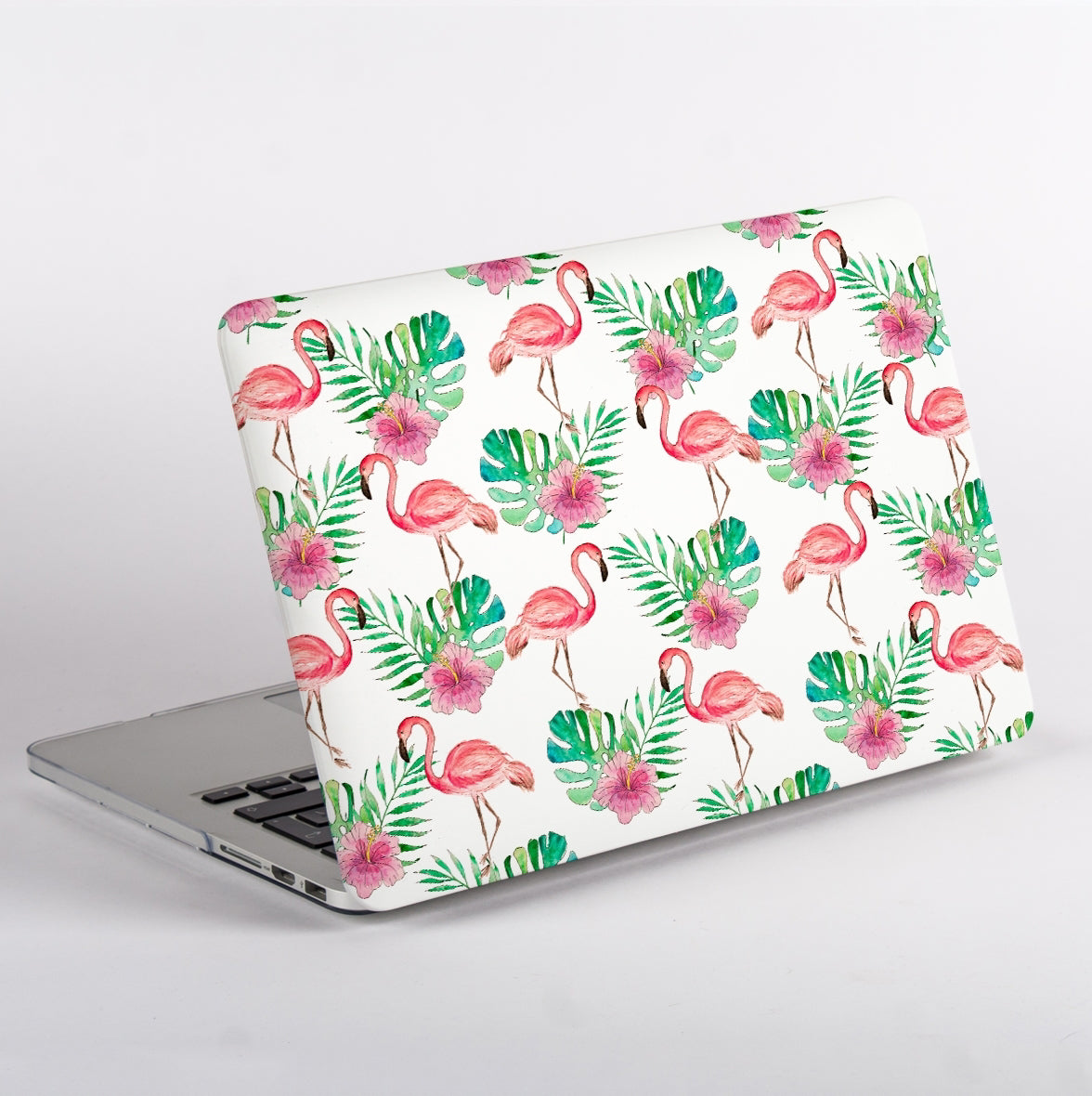 Side view of MacBook with a flamingo and leaf pattern case on a white background