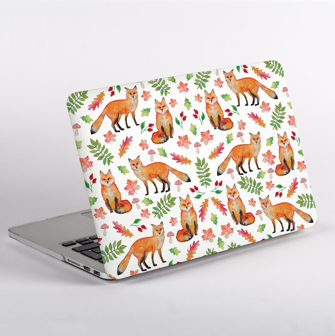 Side view MacBook Case with fox and leaf pattern on a white background