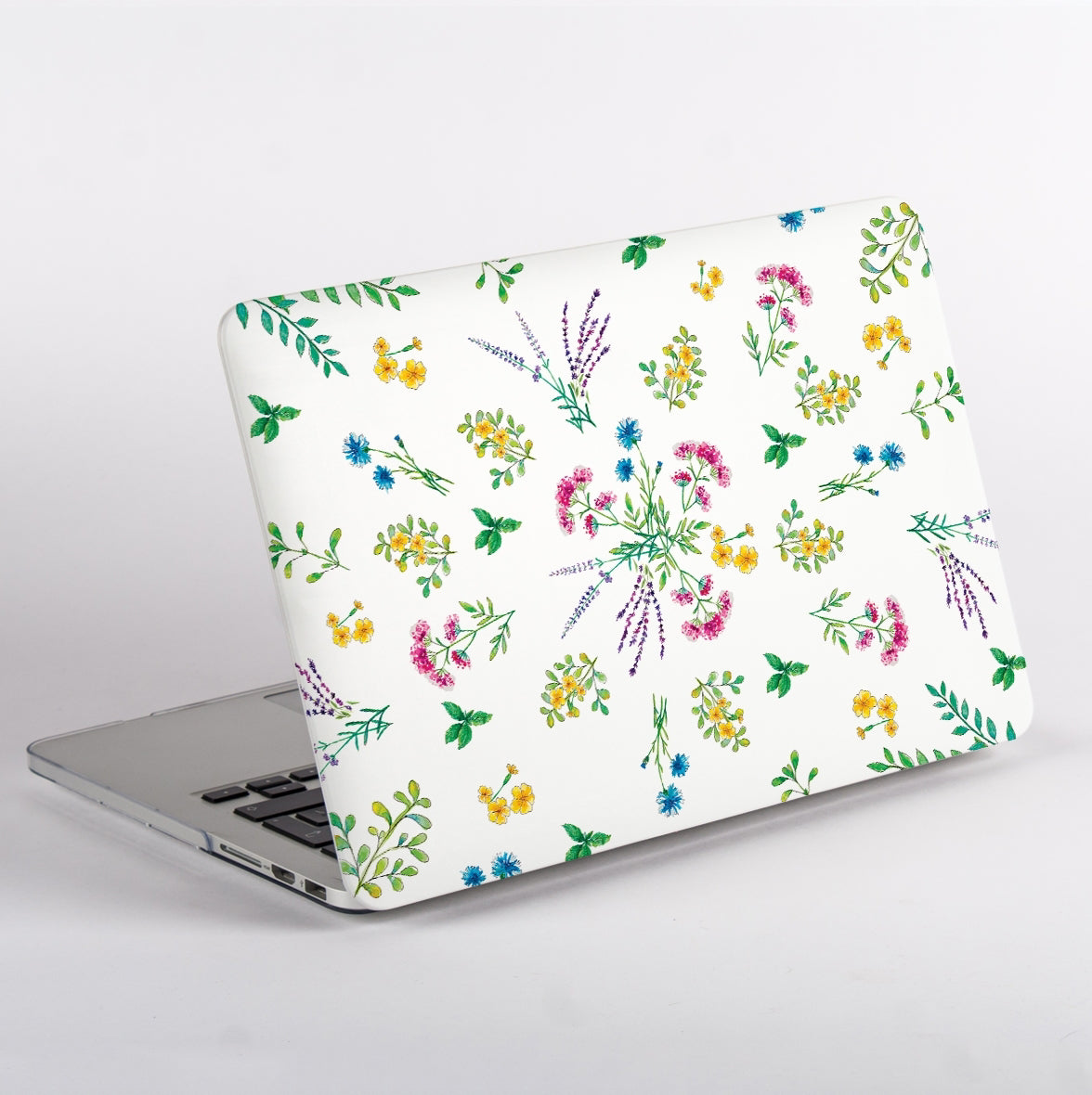 Side view of MacBook with a floral pattern Case on a white background
