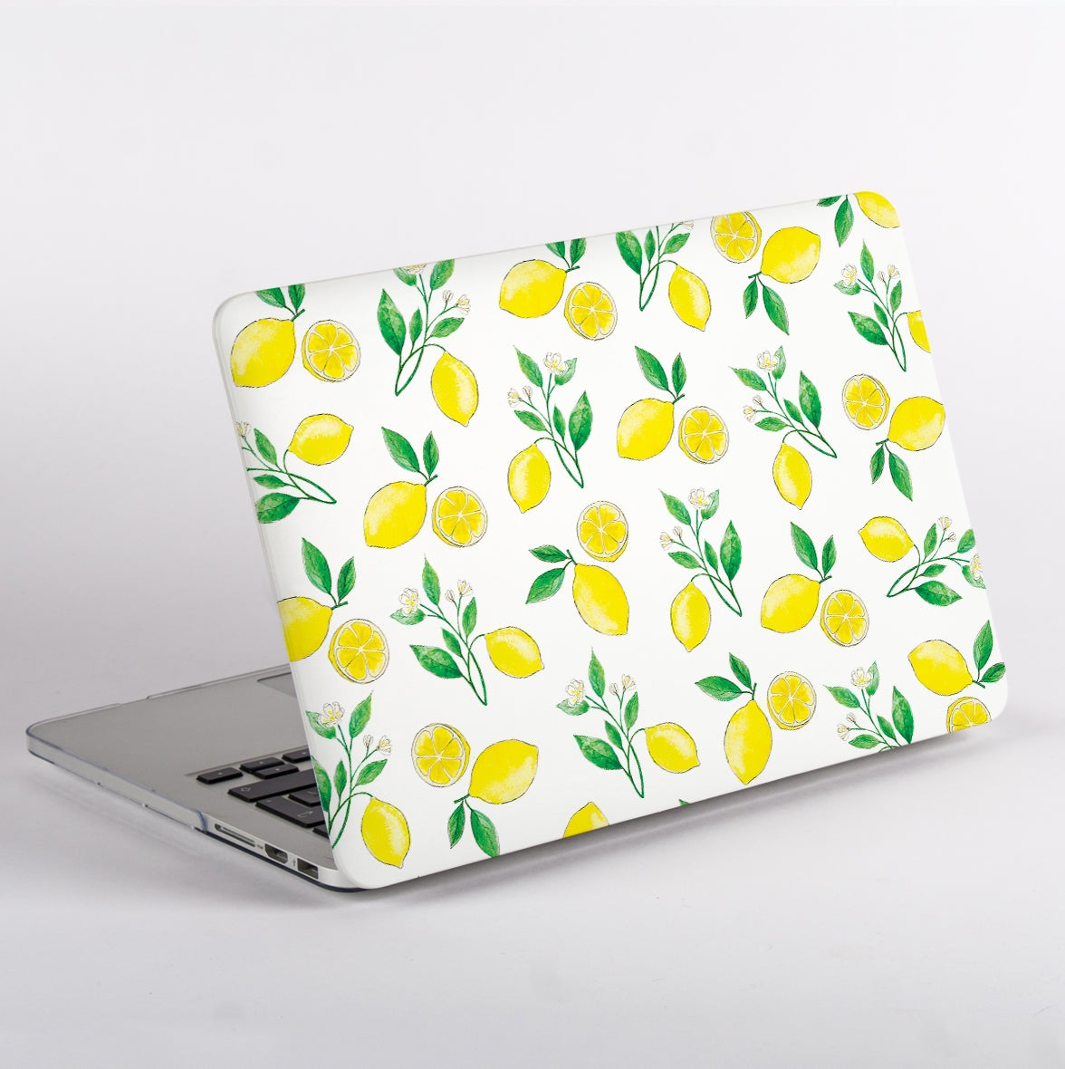 Side View of MacBook with a lemon pattern MacBook Case on a white background