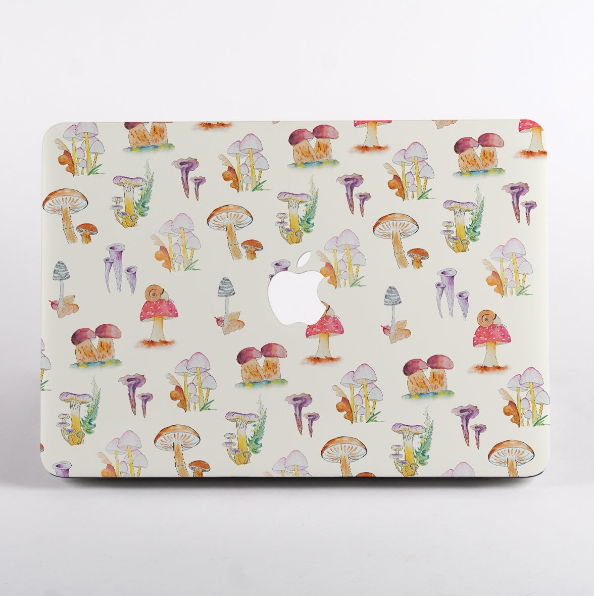 Macbook with a colorful mushroom pattern case on a white background