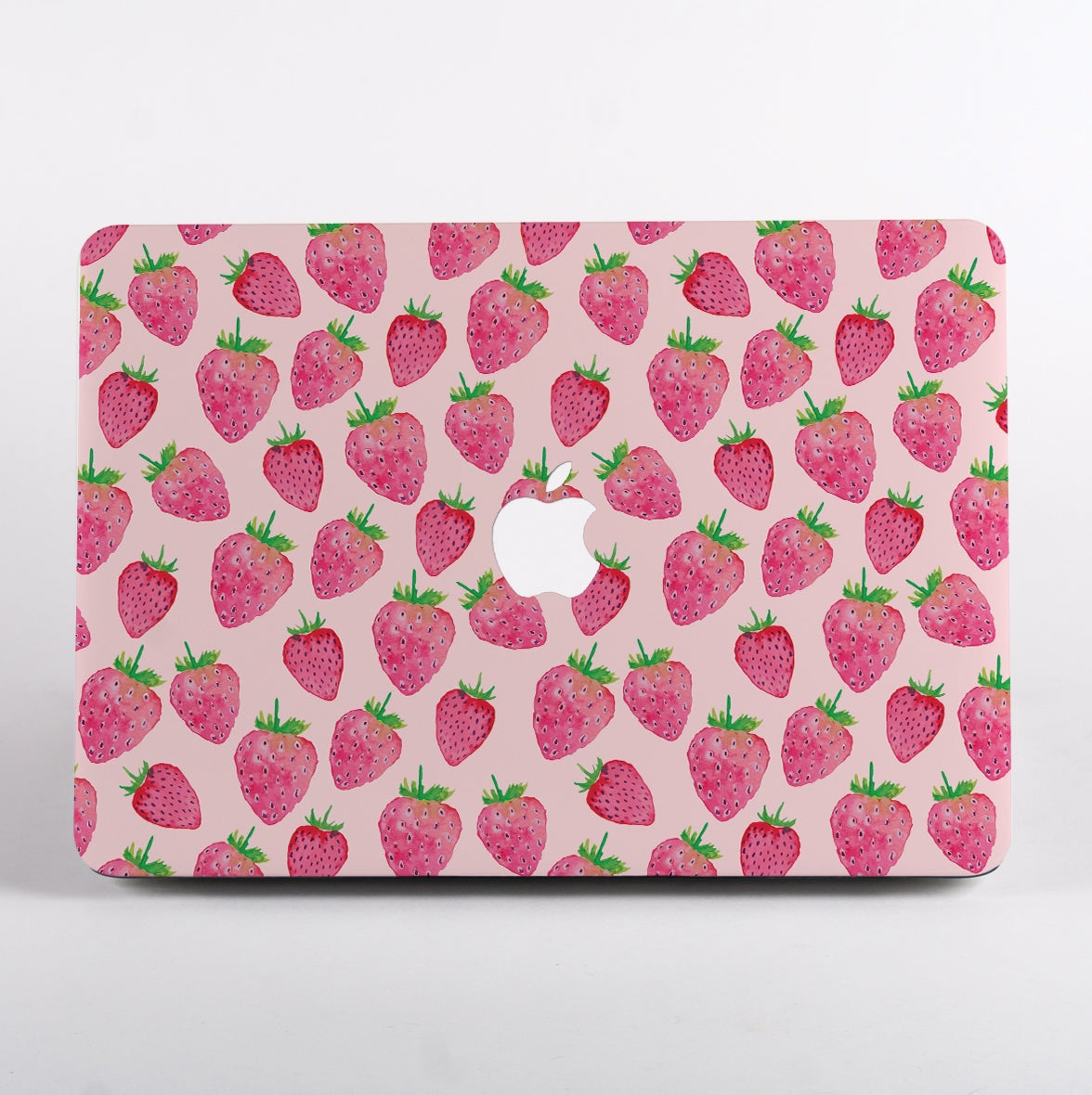 MacBook with a strawberry pattern MacBook Case on a pink background