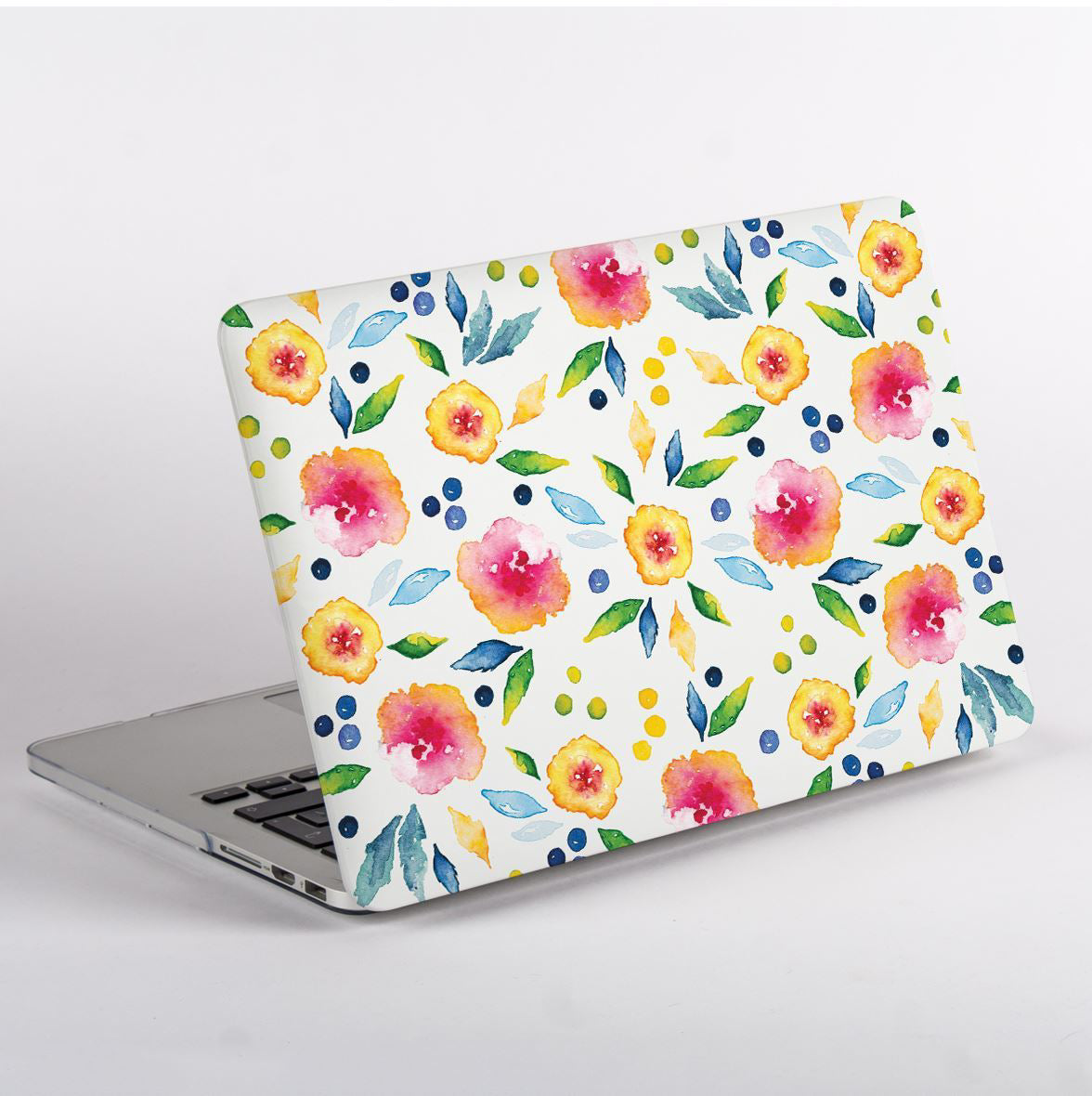 side view of MacBook with a floral patterned case on a white background