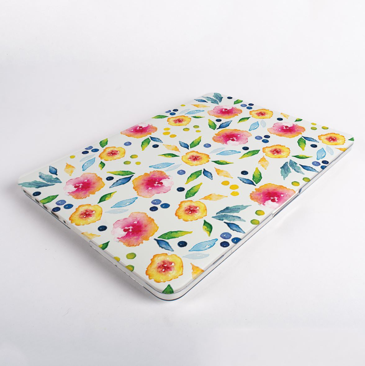 Floral patterned macbook with case on a white background