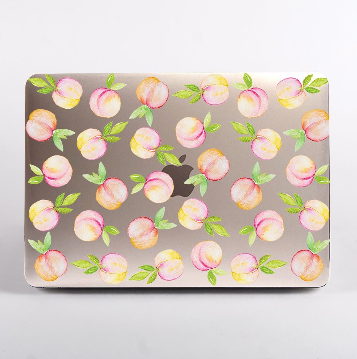 MacBook with a peach patterned clear case