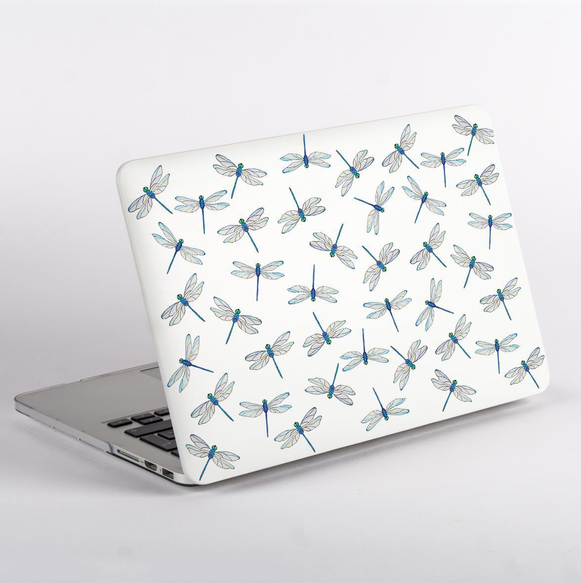 MacBook with dragonfly patterned MacBook Case skin on a white background