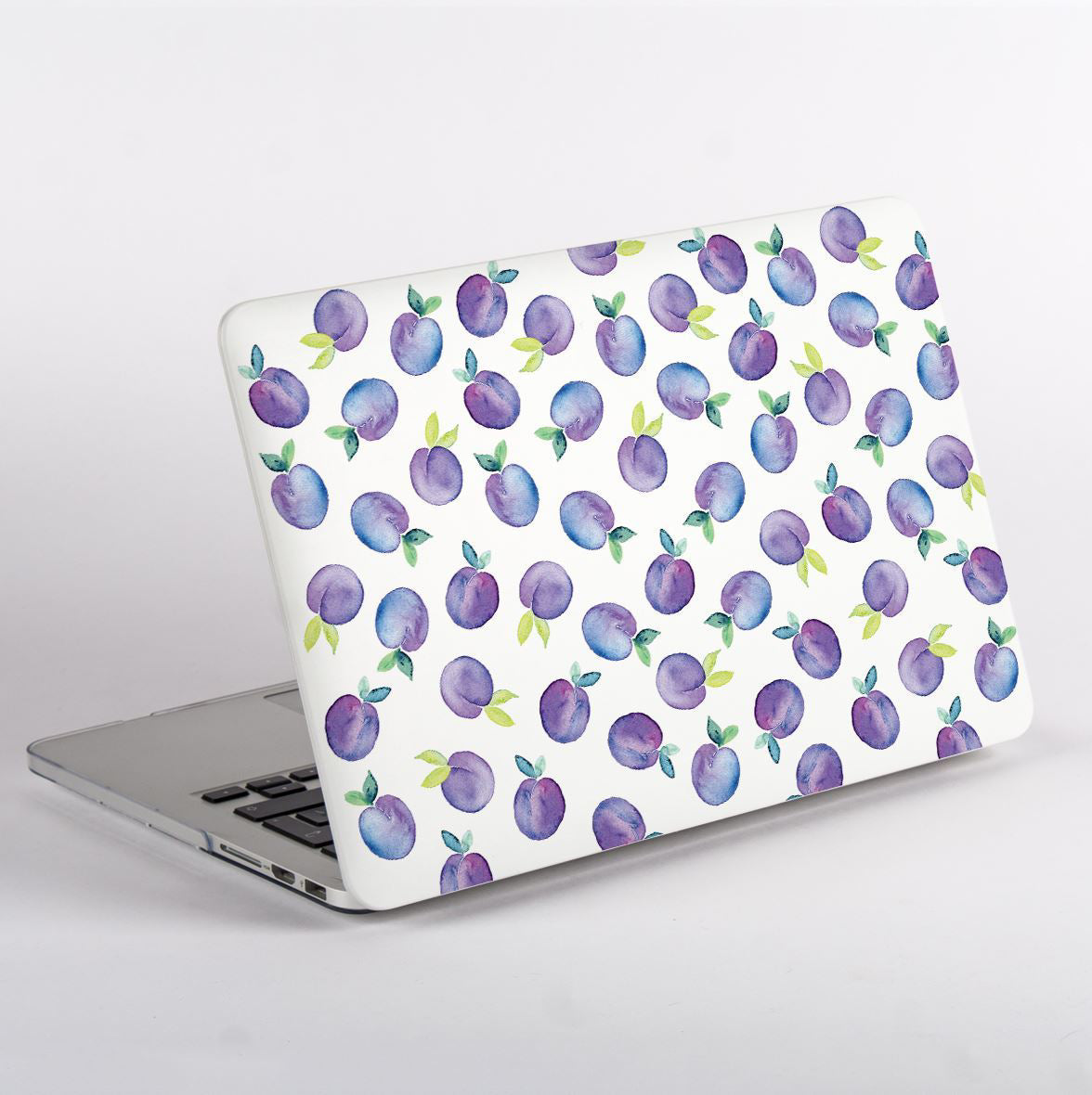 MacBook with a purple plum pattern case on a white background