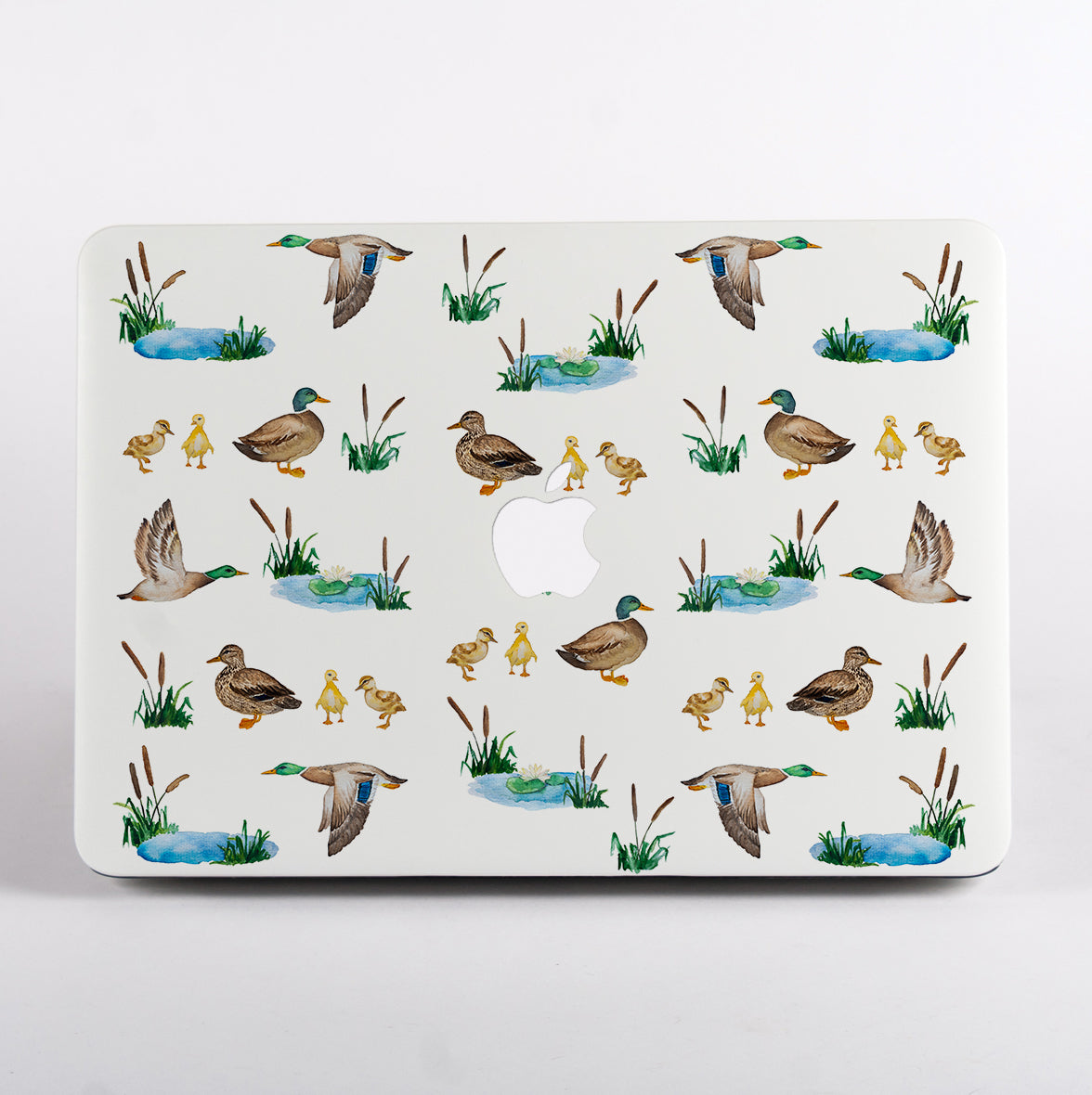 MacBook with a duck pattern case on a white background