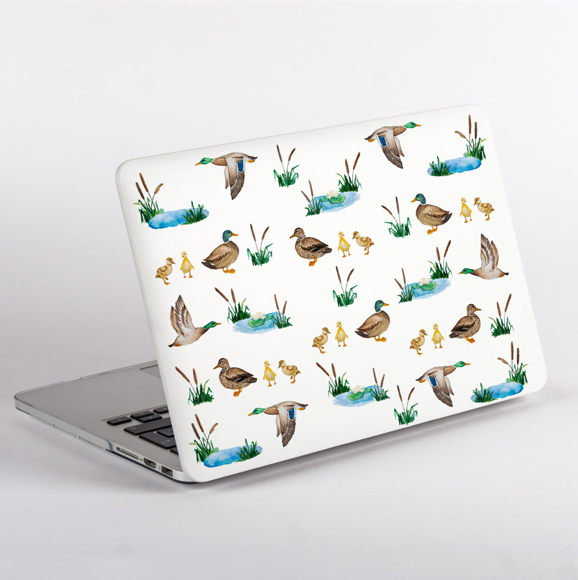 Side View MacBook with a duck pattern case on a white background