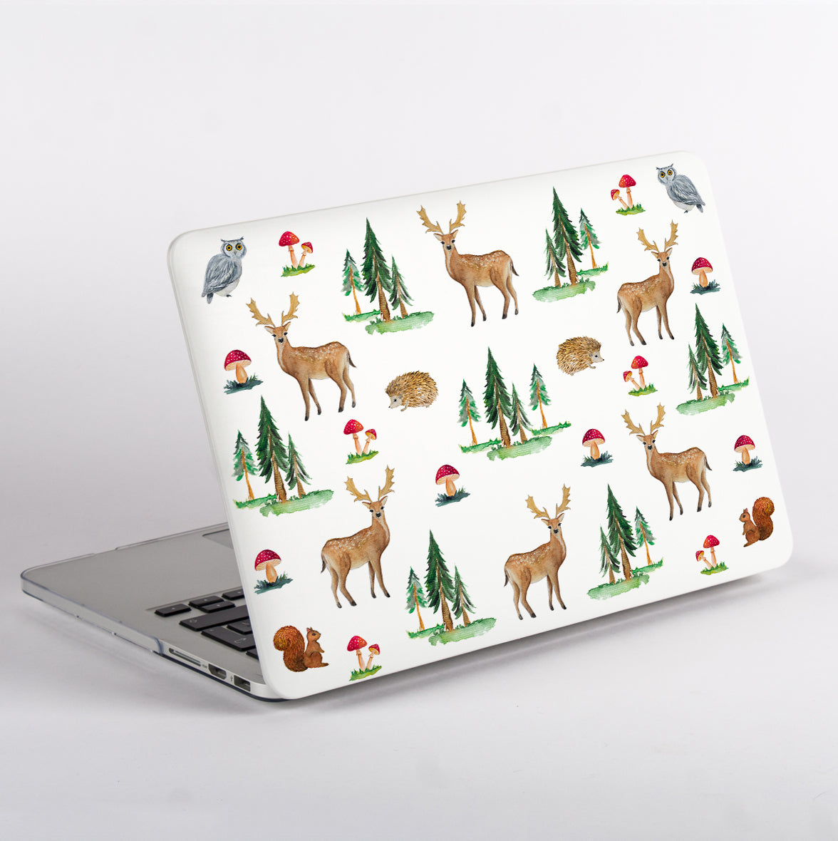 Side View of MacBook with a forest-themed MacBook Case featuring deer, trees, and mushrooms on a white background