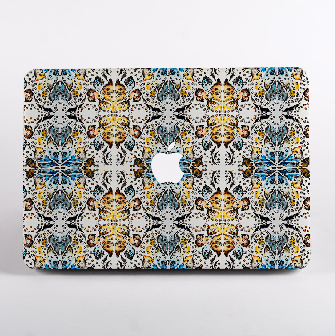 MacBook with colorful geometric animal patterned case