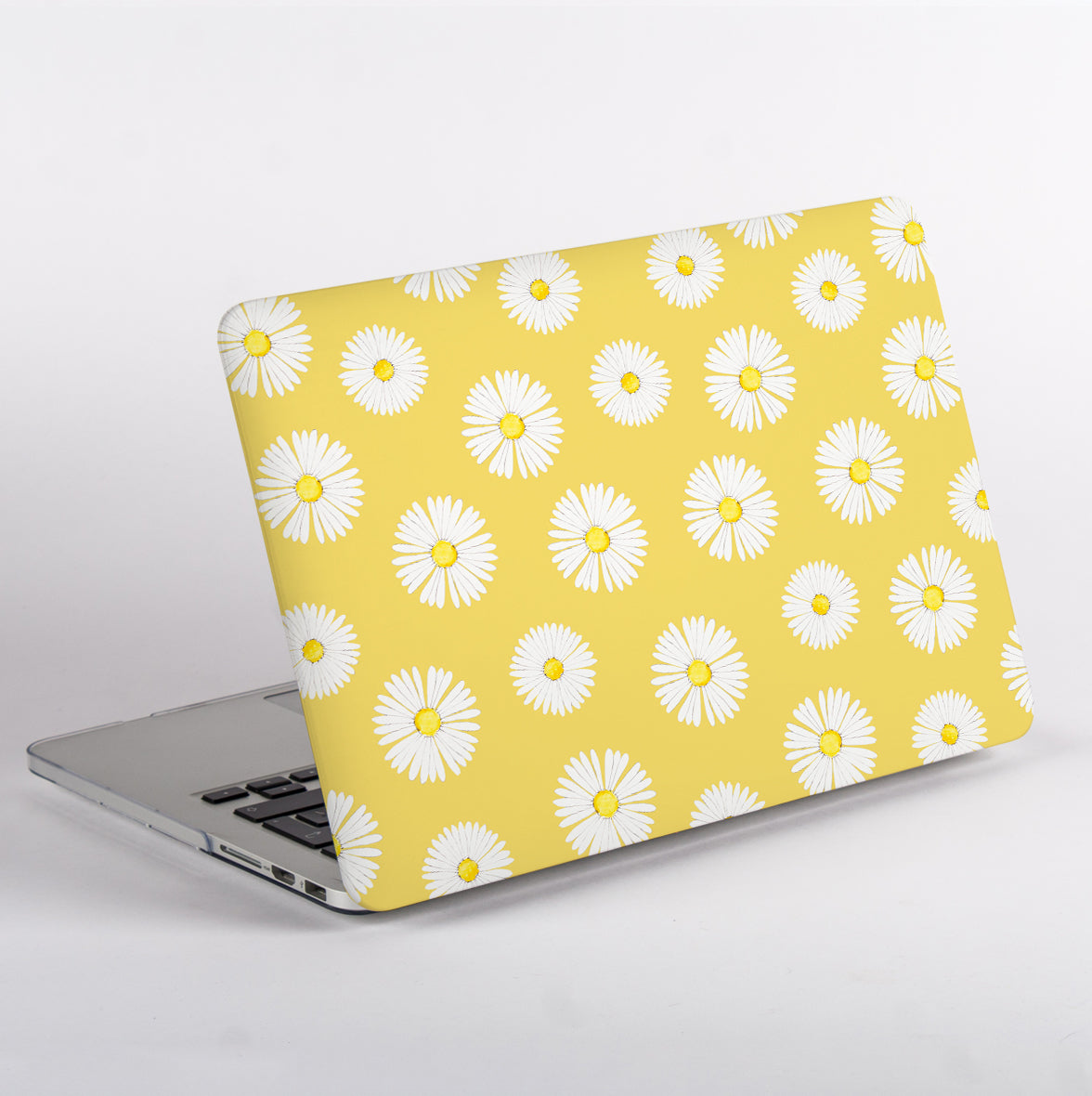 MacBook Pro with a yellow daisy patterned MacBook Case