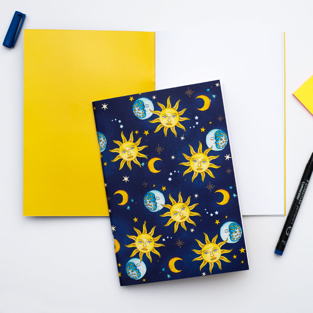 Notebook with celestial design on a white background