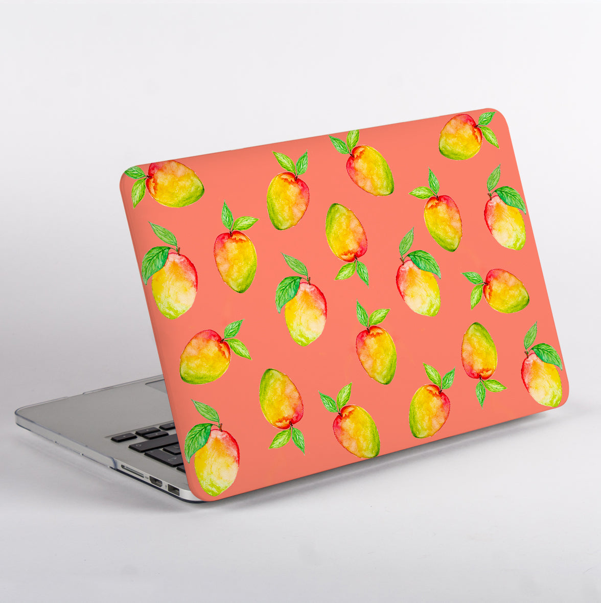 MacBook with a peach patterned case and no apple logo