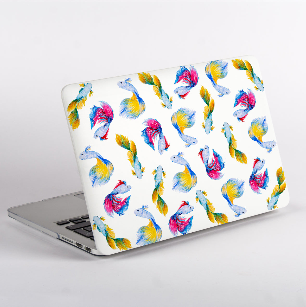 MacBook with a Betta Fish patterned white case