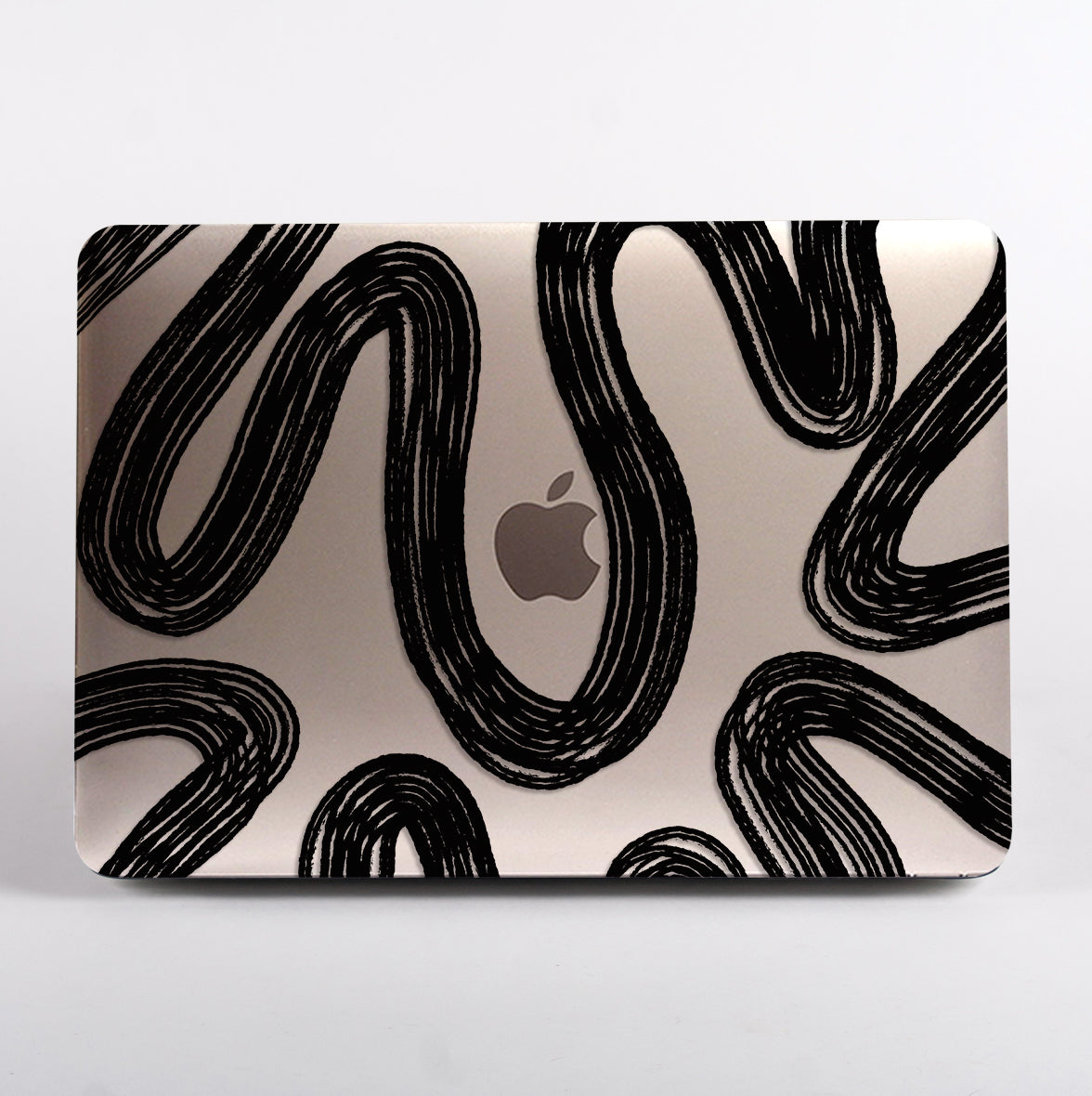 MacBook with black wavy line pattern case
