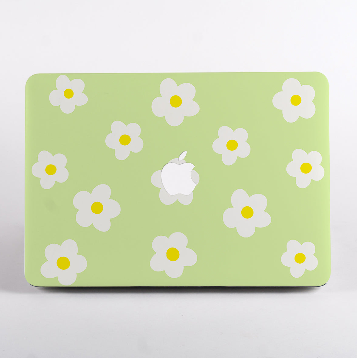 MacBook with green daisy pattern case