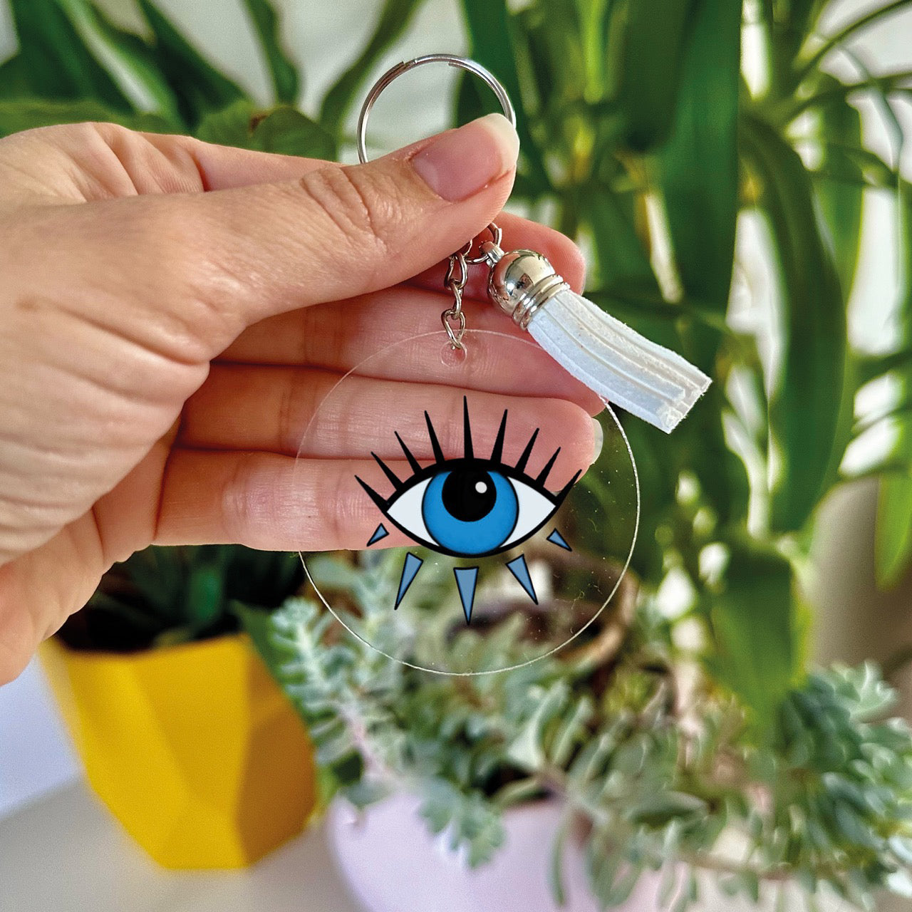 Clear acrylic keyring with Evil Eye design, perfect for keeping keys organised.