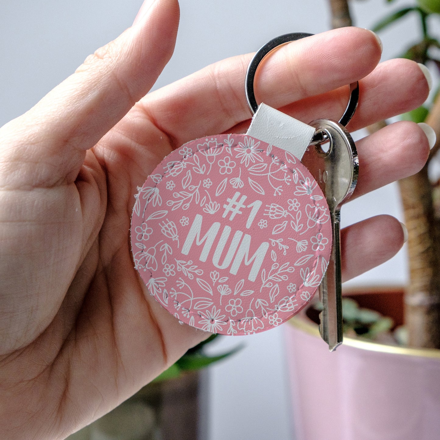 Round Pink keychain with '#1 MUM' text and floral design, perfect to show mum some love