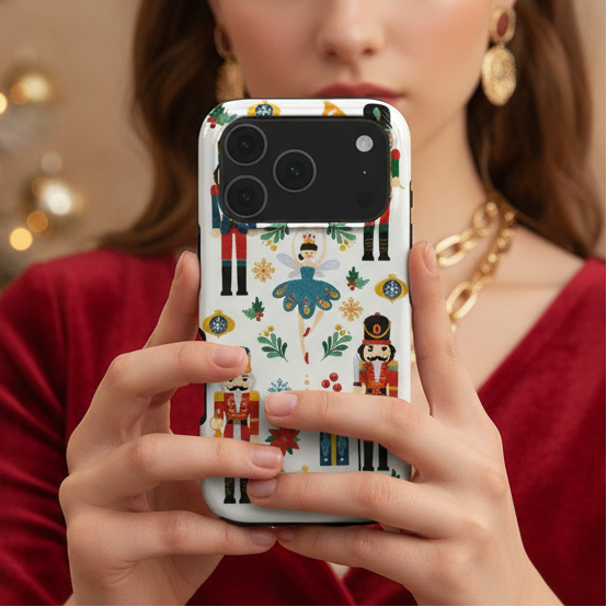 A woman holding the Nutcracker Ballet Phone Case showing it in real life