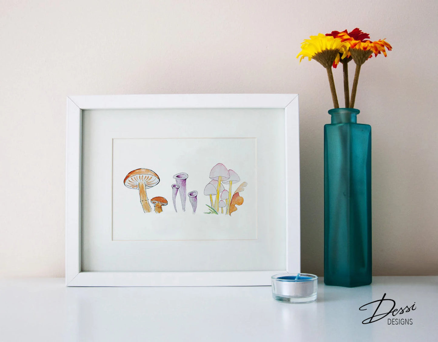 Framed artwork of mushrooms on a table with a teal vase and flowers.