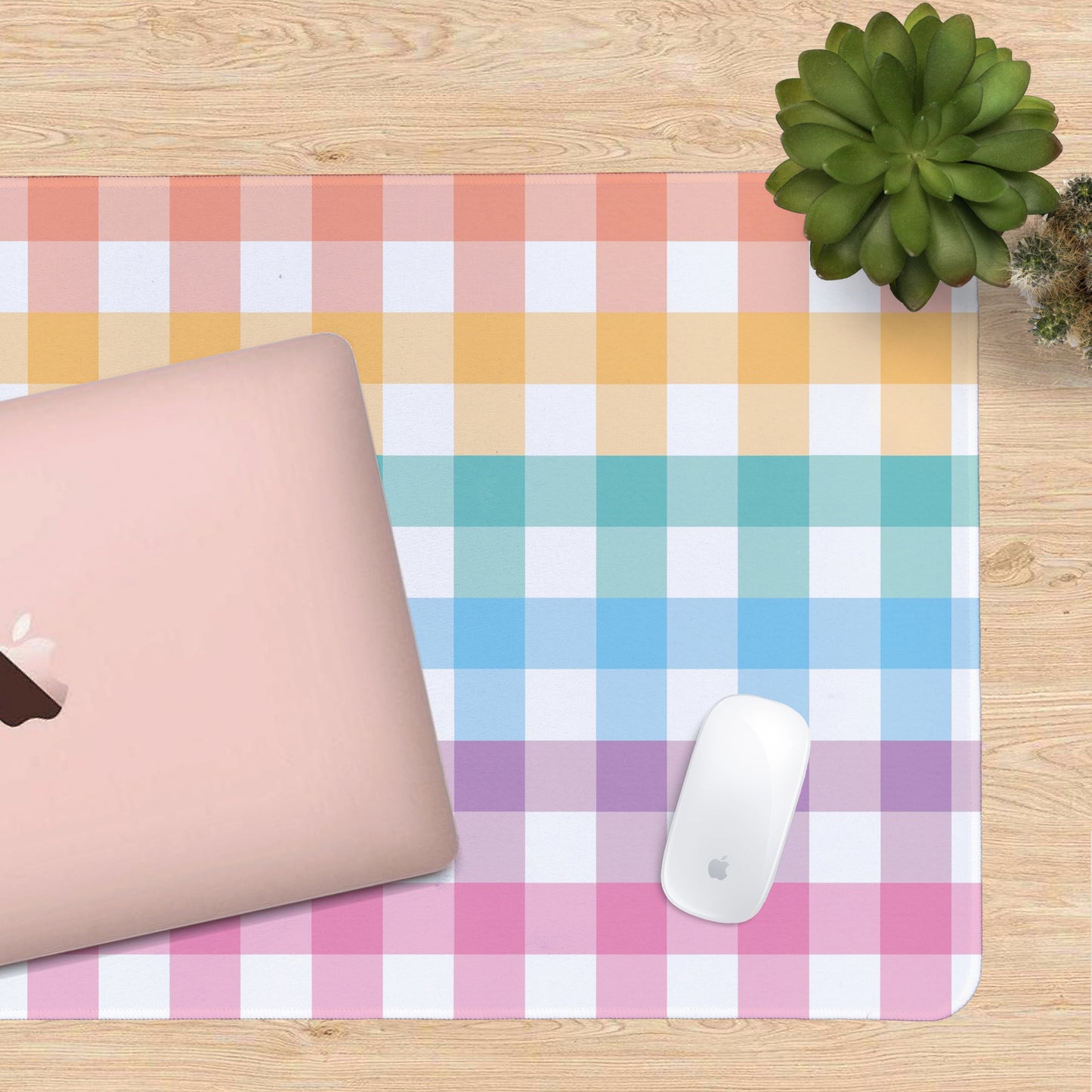 Colorful checkered desk mat with a laptop and mouse on a wooden surface