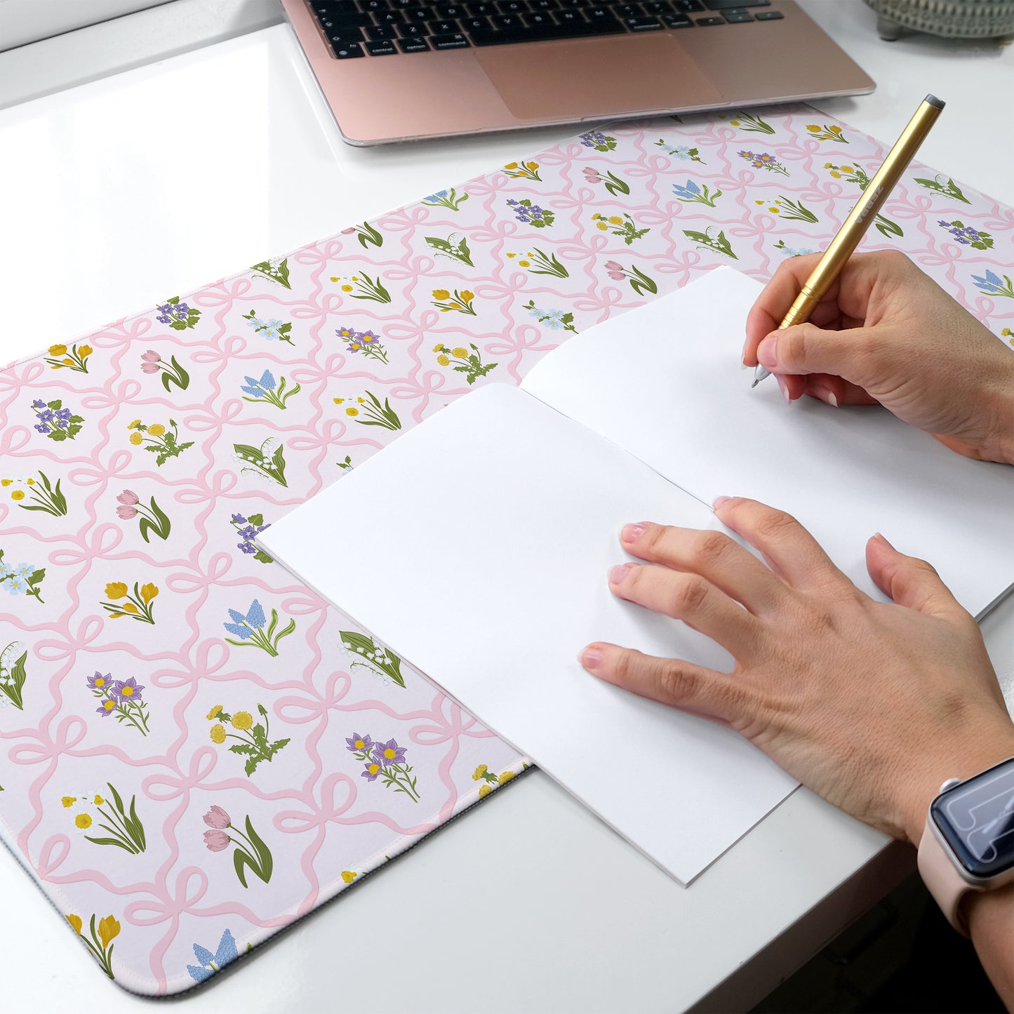 Wildflower desk mat with a soft pink bow pattern for a feminine floral aesthetic desk setup