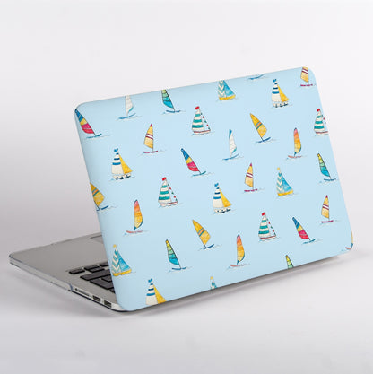 Side View of MacBook with colorful sailboat pattern case on a light blue background