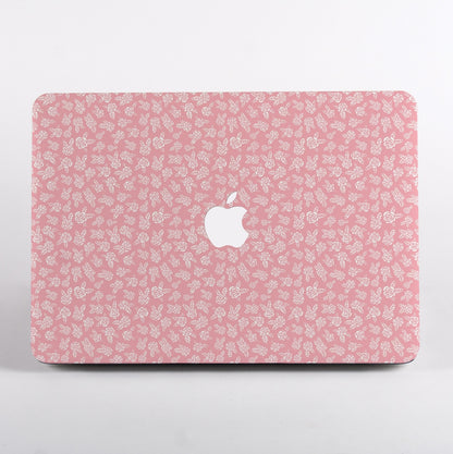 MacBook with Pink floral pattern and Apple logo Case on a light gray background