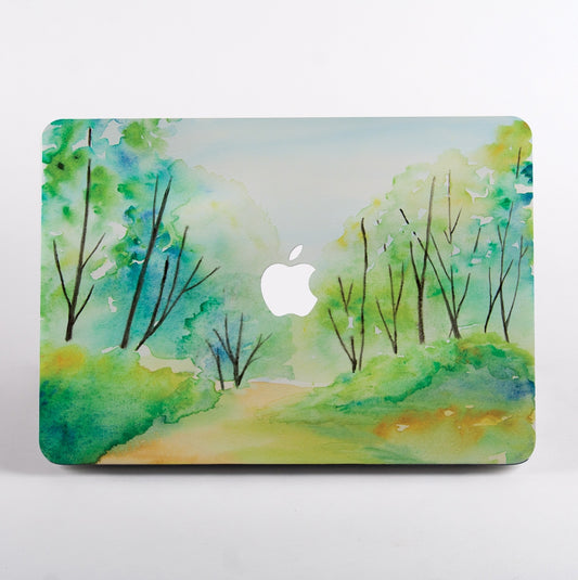 MacBook with watercolour forest painting case.