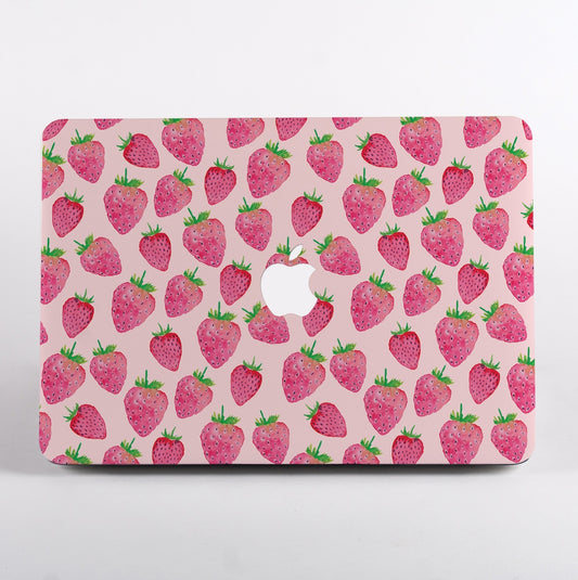 MacBook with a strawberry pattern MacBook Case on a pink background