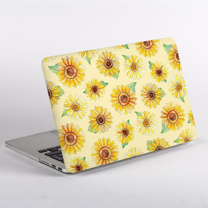 Side view of a Macbook with a sunflower patterned case on a light grey background