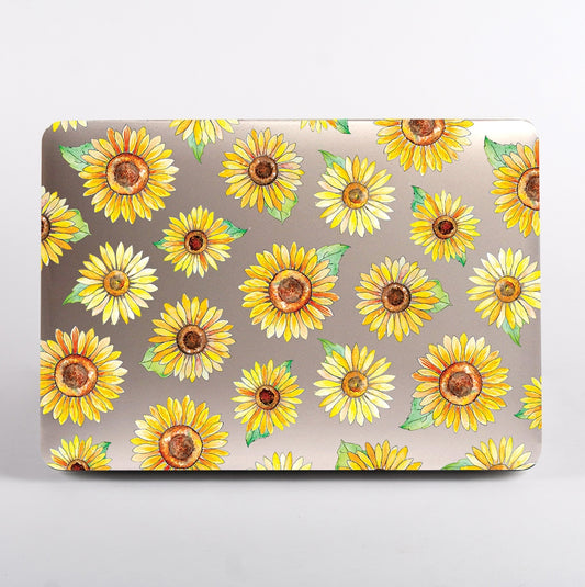MacBook with sunflower pattern clear case on a grey background