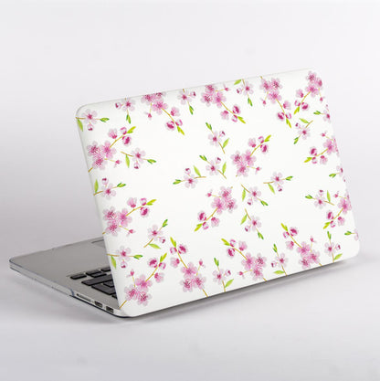MacBook with a floral design case on a white background