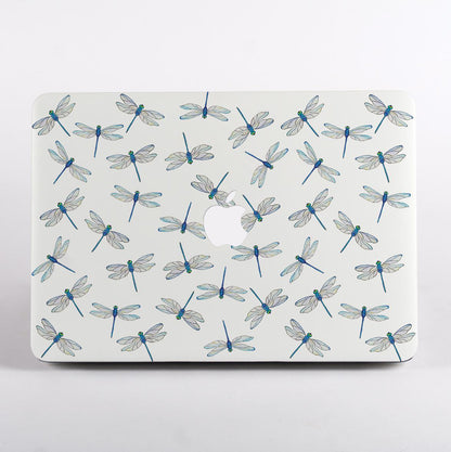 MacBook with dragonfly pattern case on a light gray background