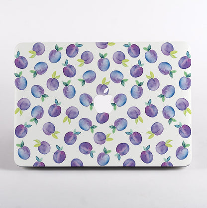 MacBook with a purple fruit pattern case on a white background