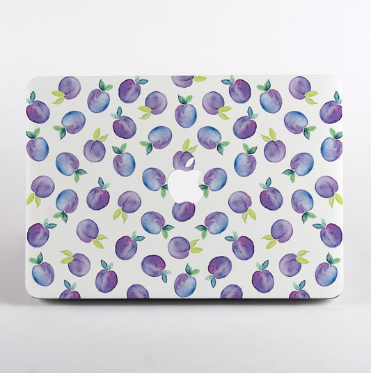 MacBook with a purple fruit pattern case on a white background