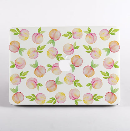 MacBook with a peach pattern case on a white background