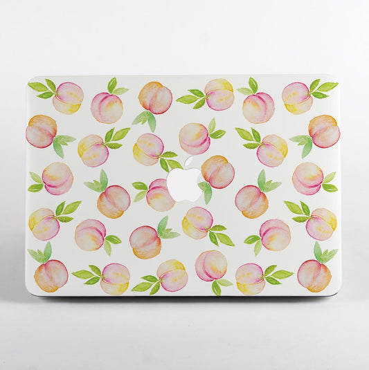 MacBook with a peach pattern case on a white background