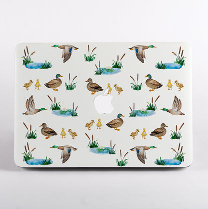 MacBook with a duck pattern case on a white background