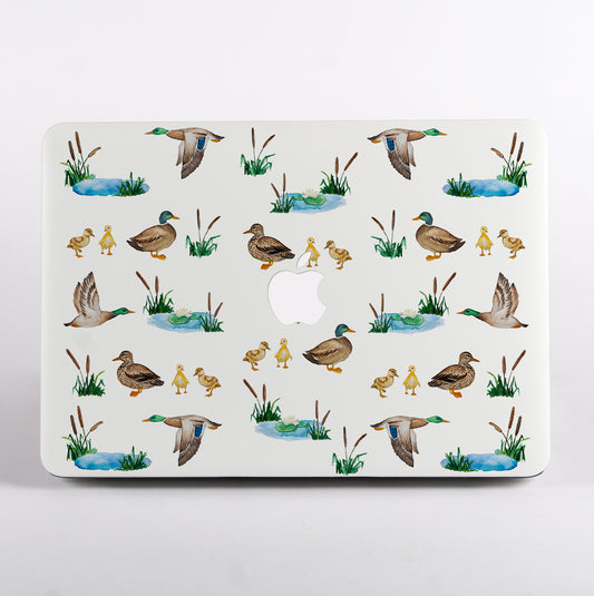 MacBook with a duck pattern case on a white background