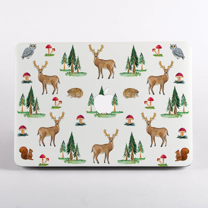 MacBook with a forest-themedMacBook Case featuring deer, trees, and mushrooms on a white background.