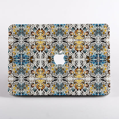 MacBook with colorful geometric animal patterned case 