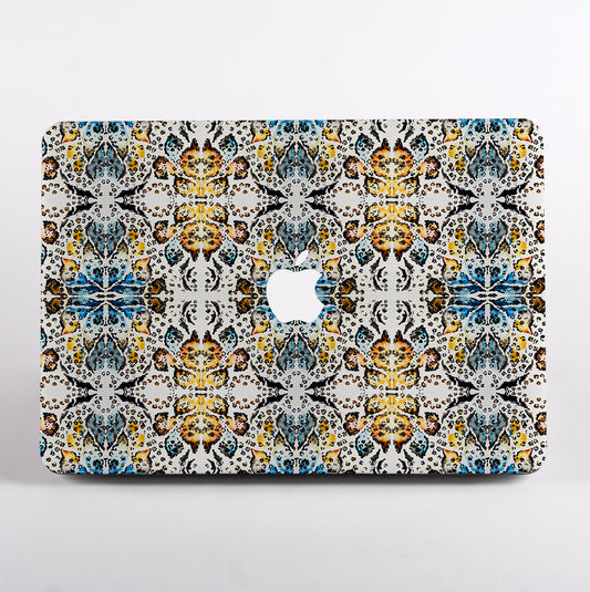 MacBook with colorful geometric animal patterned case 