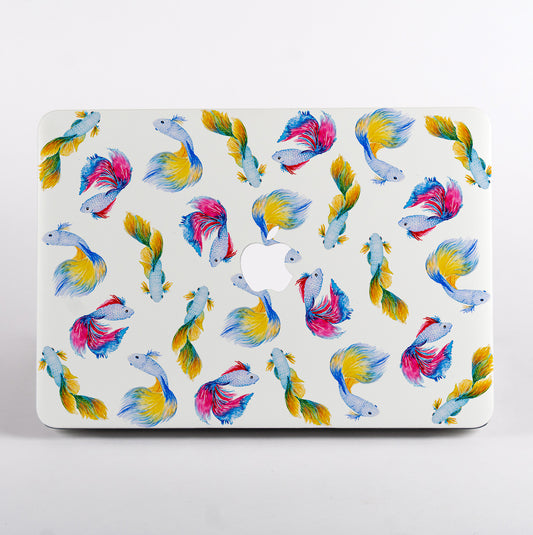 MacBook with colorful fish pattern on a white background