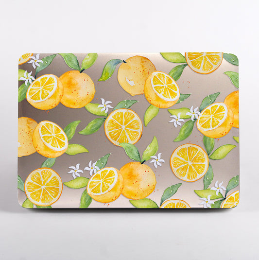 MacBook with lemon and orange clear case
