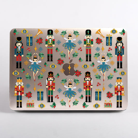 MacBook with a Christmas-themed case featuring nutcrackers and ballerinas