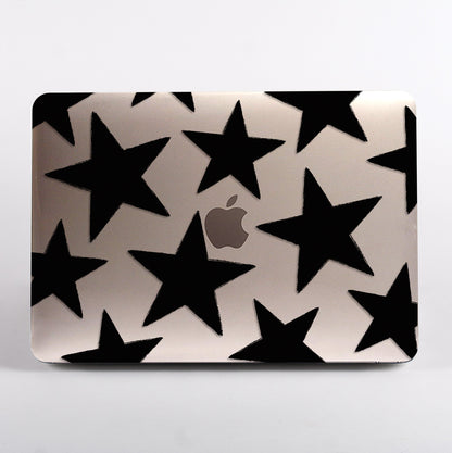 Macbook with a clear black star pattern case 
