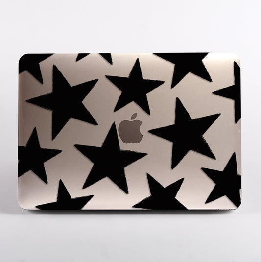 Macbook with a clear black star pattern case 